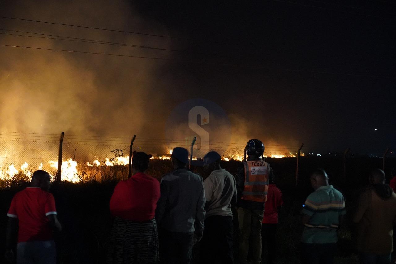 [PHOTOS] Residents look on as fire guts part of JKIA